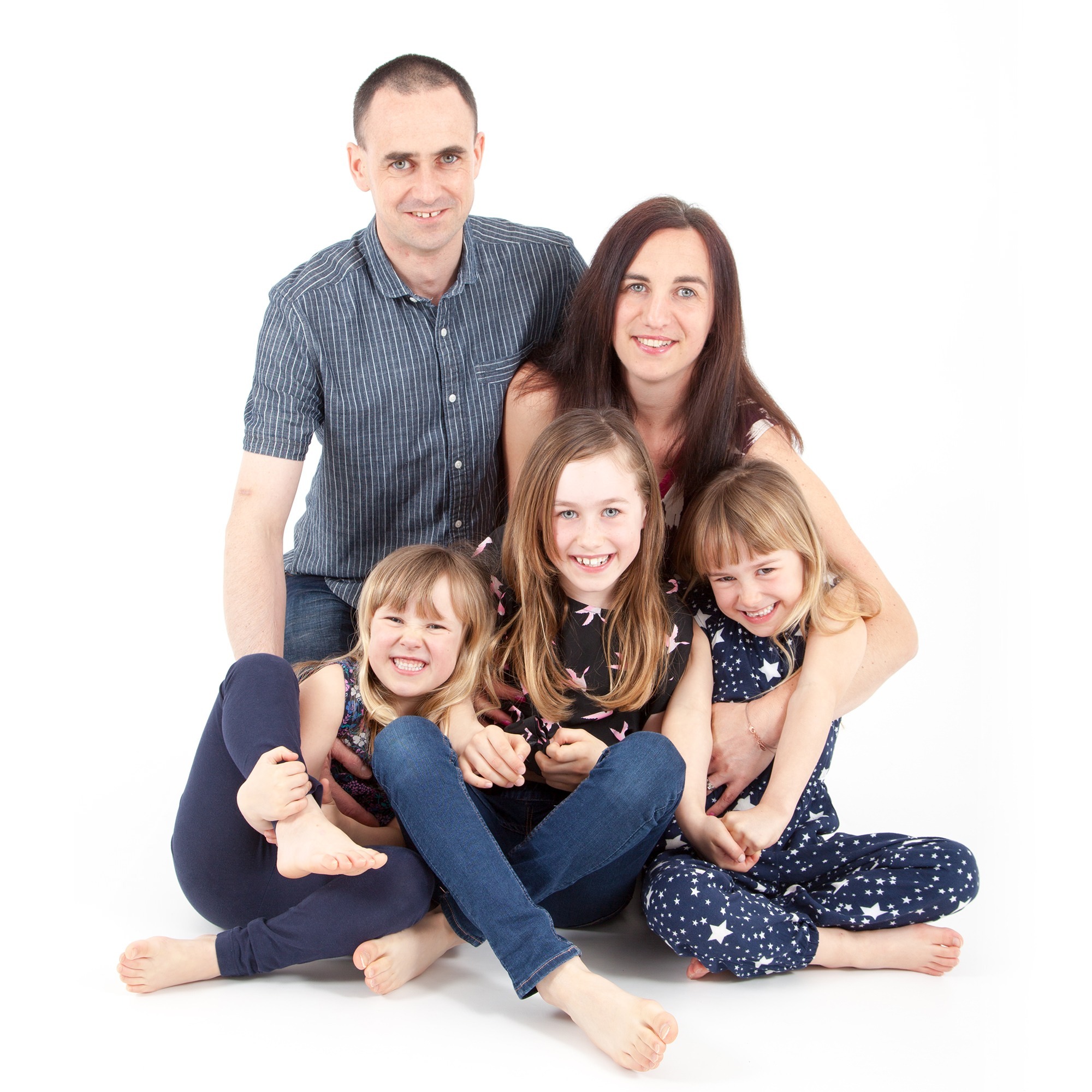 Family Cuddled Together Bristol Portrait Studio Photographer Gallery Image by West 70 Photography in Downend